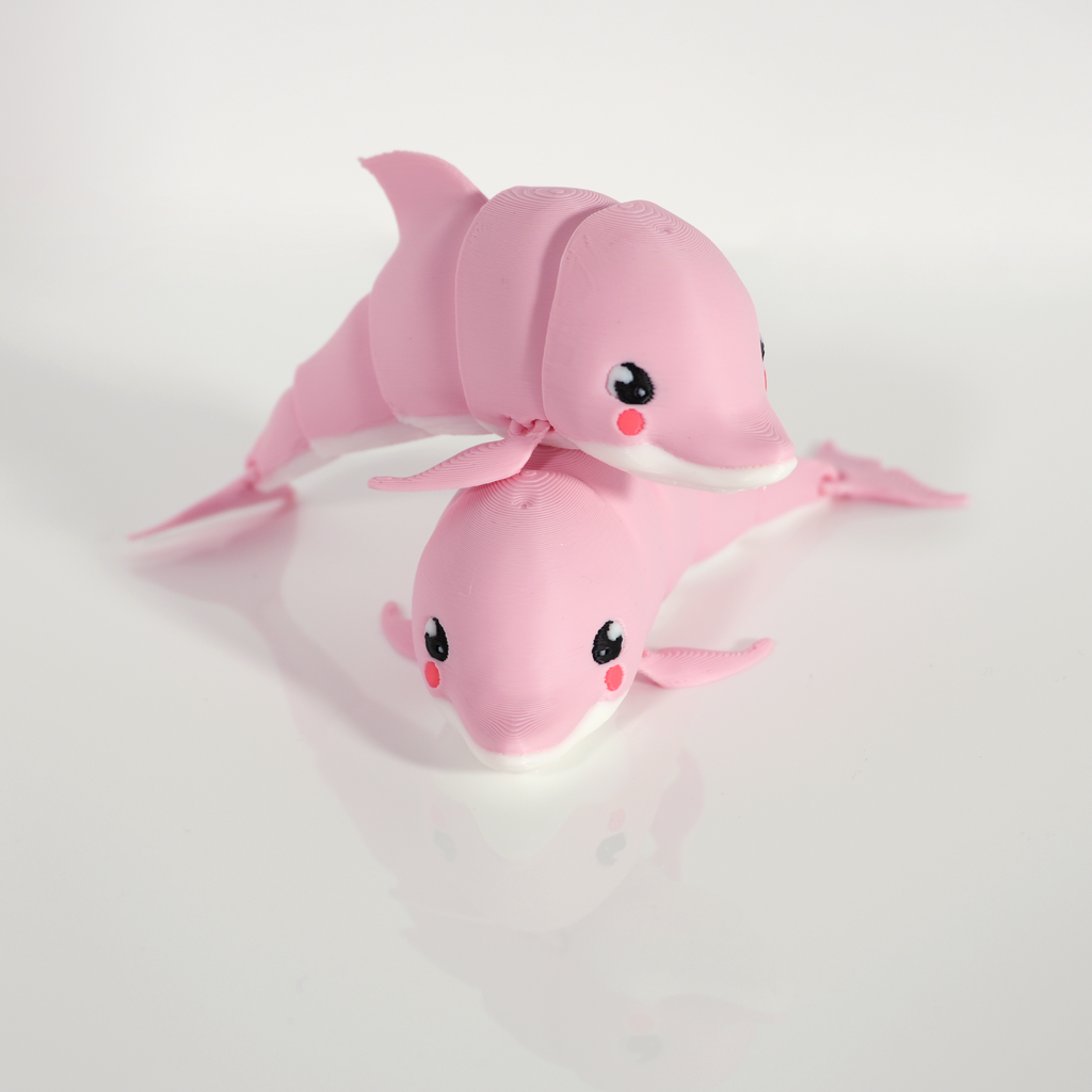 Two pink kawaii dolphin 3D prints stacked on each other