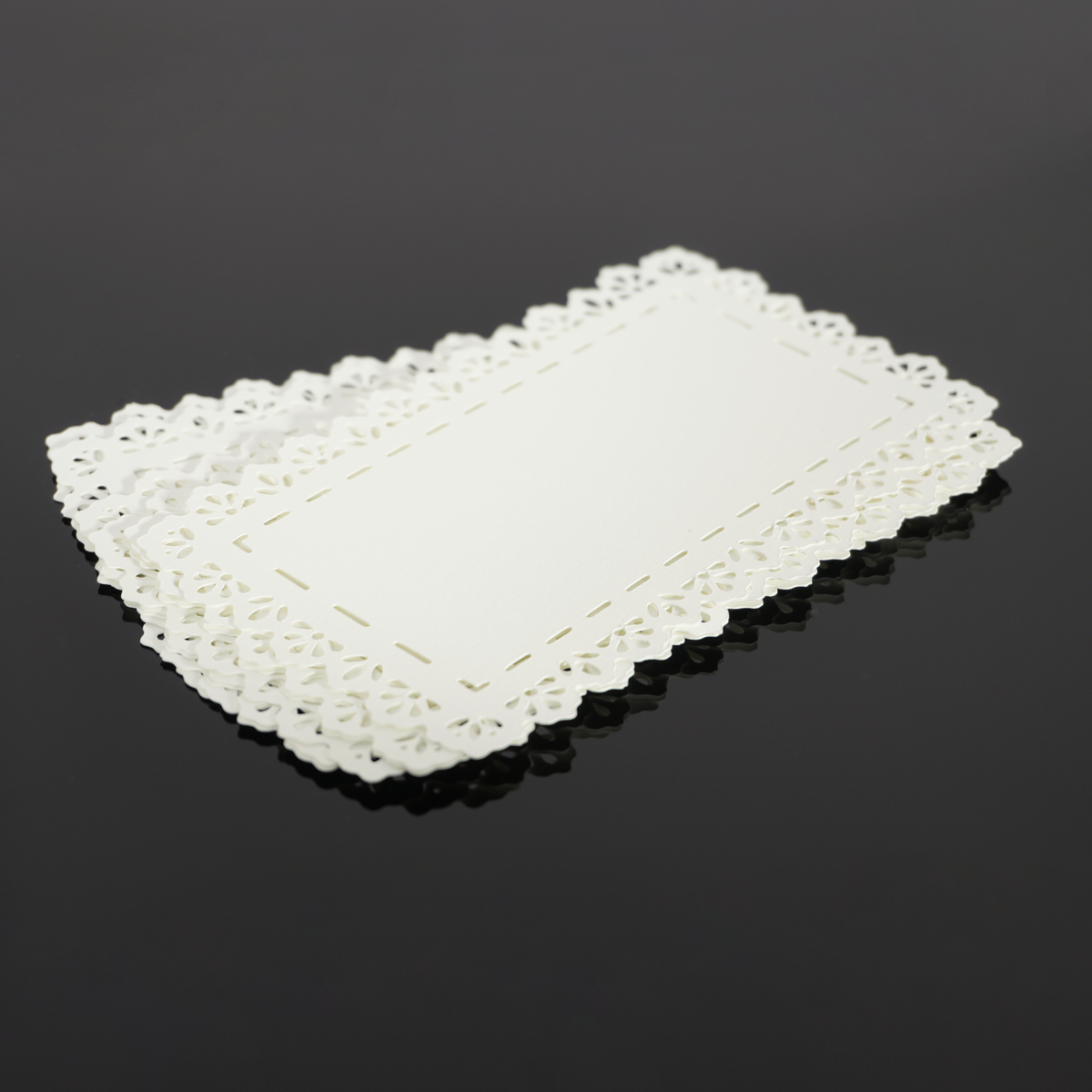 Stack of Lace Rectangle cut paper pieces