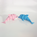 Pink and blue articulated dolphins lying side by side