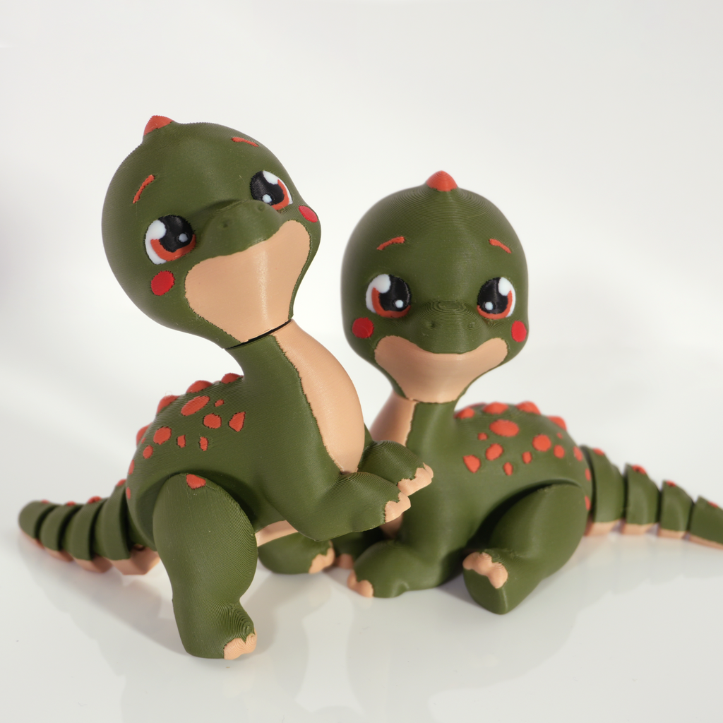 Pair of Tiny Diny 3D-printed dinosaurs side by side