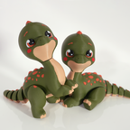 Pair of Tiny Diny 3D-printed dinosaurs side by side