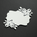 Lily lace-cut paper: a white scalloped tag with cut-out lily flowers in two corners